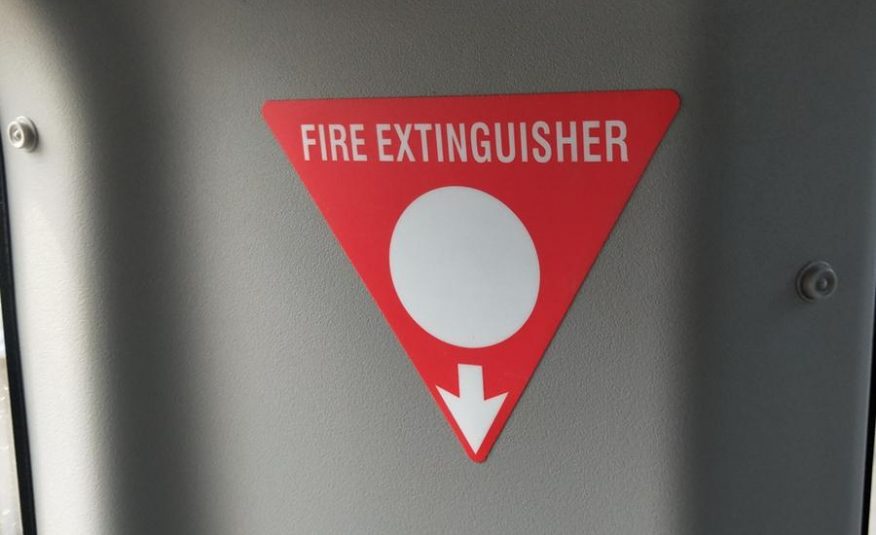 Fire extinguisher sign | Featured image of the Coaster Bus Conversion page for Bus 4x4 Group