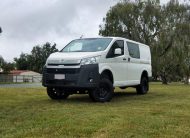 Van outside in a field | Featured image for the Toyota HiAce 4x4 Conversion Page for Bus 4x4 Group