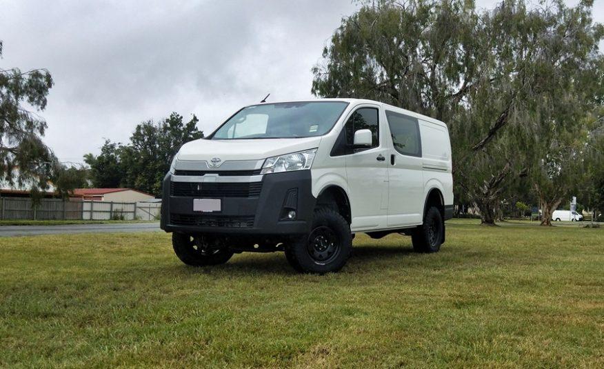 Van outside in a field | Featured image for the Toyota HiAce 4x4 Conversion Page for Bus 4x4 Group