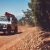 4WD being driven down a dirt road | Featured image of the 4WD Maintenance – What to Check Before Starting Your Adventure blog for Bus 4x4 Group