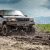 4x4 vehicle tearing through a muddy road | Featured image of the Choosing a Conversion Company – Finding the Right Fit for You blog for Bus 4x4 Group.